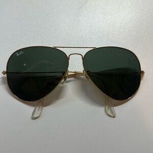 Gold and black wire frame Ray-Ban aviators